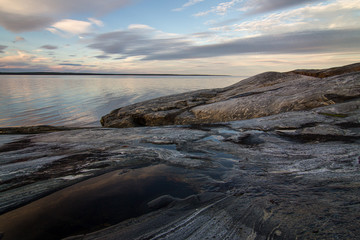 rocks at sunset on the white sea