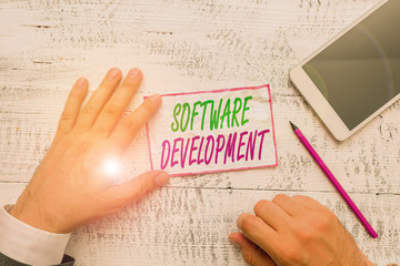 conceptual hand writing showing software development. concept meaning software is created using a sp