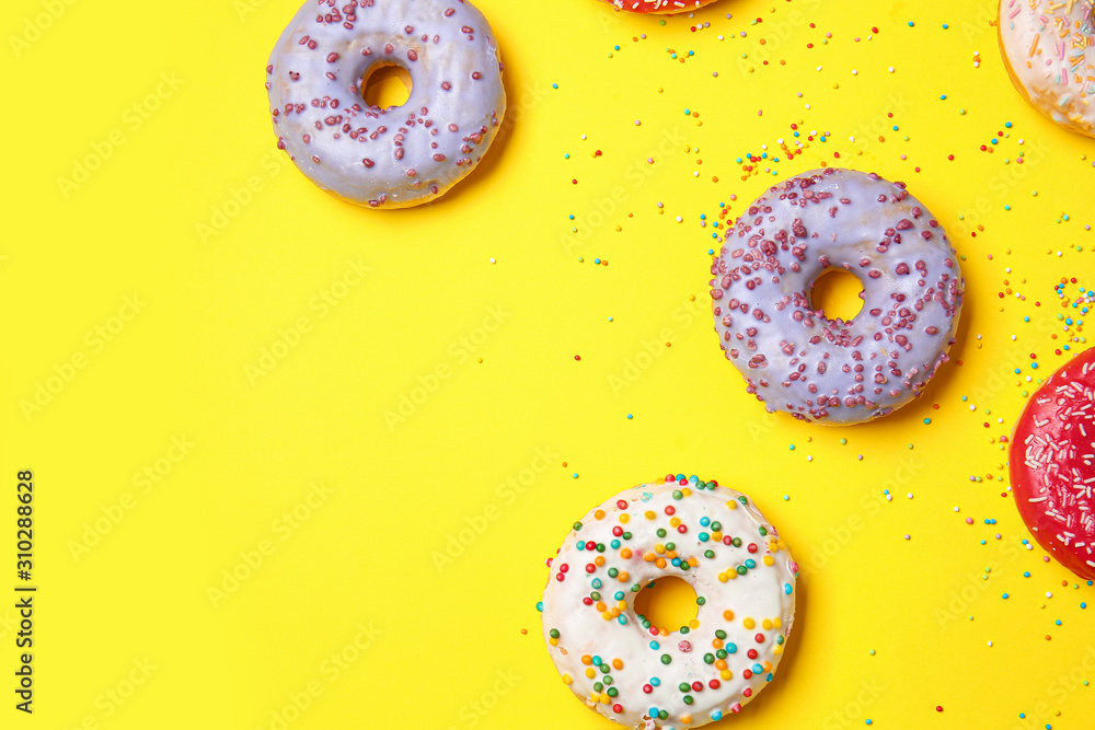 Sweet tasty donuts on color background