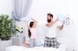 © be free - Active and dynamic. Active family fight with pillows. Little child and father enjoy playing games. Pillow fight. Active and happy. Enjoying themselves