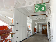 A Cruise Ship Sign Designating Where The Assembly Station Is In Case Of Emergency.