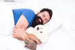 © be free - Good night. Sleep well. Sweet dreams. Bearded hipster play toy. Valentines day gift. Man sleep hug soft toy relaxing in bed. Cute teddy bear toy. Softness tenderness. Playful adult fall asleep