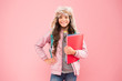 Work Hard. small happy girl earflap hat. back to school. winter holiday and vacation. kid warm clothes pink background. pupil daily life. schoolgirl carry backpack and books go home. no more exams