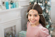 © be free - pretty little princess celebrate christmas. smiling cute child at home. happy new 2020 year. holiday party celebration. christmas home decoration. xmas shopping time. awaiting new year