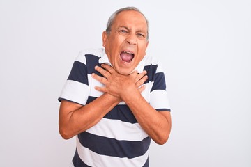 Sticker - Senior grey-haired man wearing casual striped polo standing over isolated white background shouting and suffocate because painful strangle. Health problem. Asphyxiate and suicide concept.