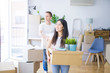 © Krakenimages.com - Young beautiful couple moving cardboard boxes at new home