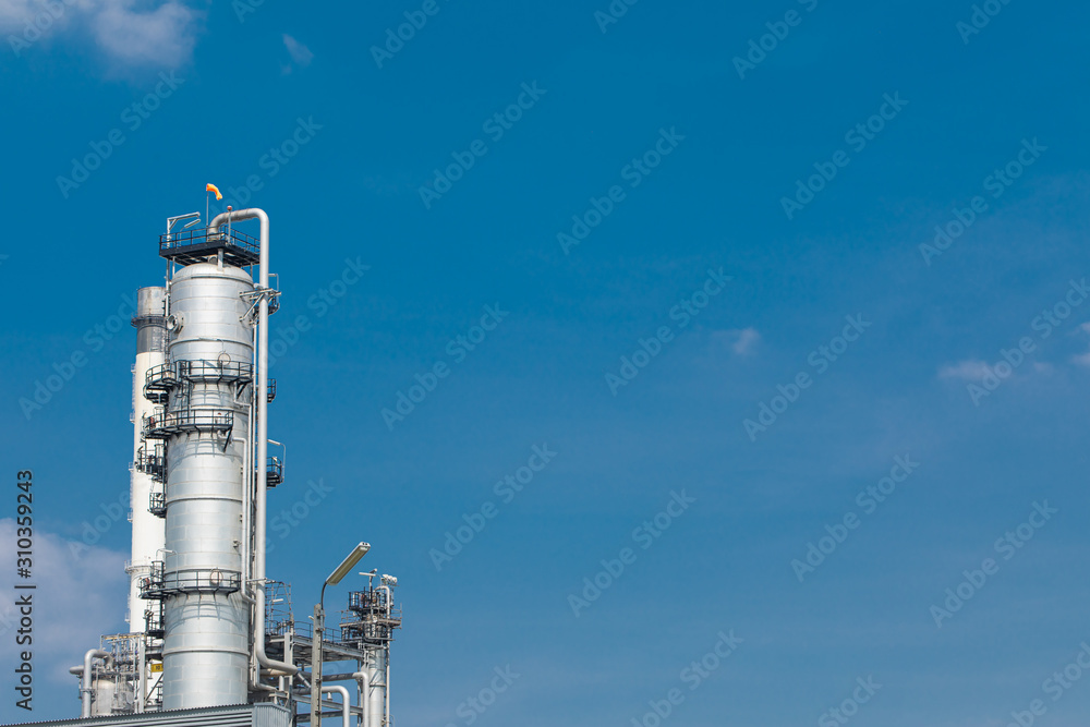 Oil and gas industrial,Oil refinery plant form industry,Refinery factory oil storage tank and pipeline steel blue sky background