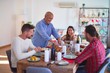 © Krakenimages.com - Beautiful family smiling happy and confident. Carving roasted turkey celebrating Christmas at home