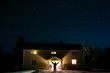 © Johnér - Person in front of illuminated house at night