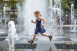 © Johnér - Girl running over fountain