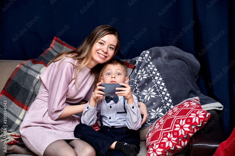 Portrait of a happy family: mom and a cute boy of 10 years of schoolboy ...