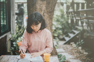 Soft focus young women prayer and read holy bible.bible study concept