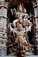 wooden heritage carving garuda naga and gods , art wall at door in temple .