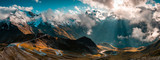 Fototapeta Góry - Panoramic Image of Grossglockner Alpine Road. Curvy Winding Road in Alps.