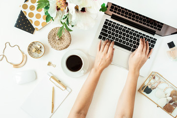 Wall Mural - Woman hands working on laptop. Home office desk table workspace with laptop on white background. Flat lay, top view freelance work concept.