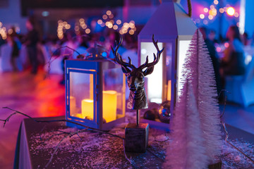 Deer and candle decoration of a christmas corporate or wedding event in Eastern Europe Latvia Riga - Dark violet and purple colors