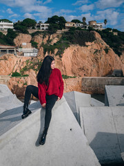 woman on rocks in harbor