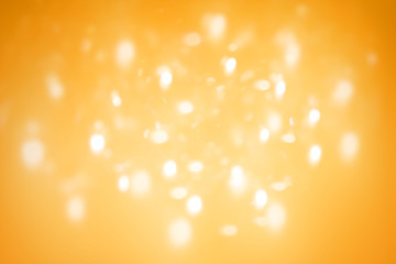 Wall Mural - white bokeh on orange gradient background,abstract gold wallpaper.