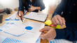 © snowing12 - Business People Talking Discussing with coworker planning analyzing financial document data charts and graphs in Meeting and successful teamwork Concept.