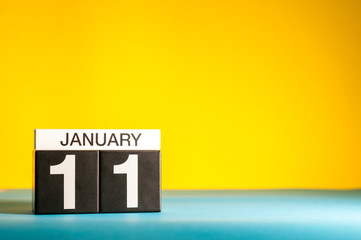 Sticker - January 11th. Day 11 of january month, calendar on yellow background. Winter time. Empty space for text