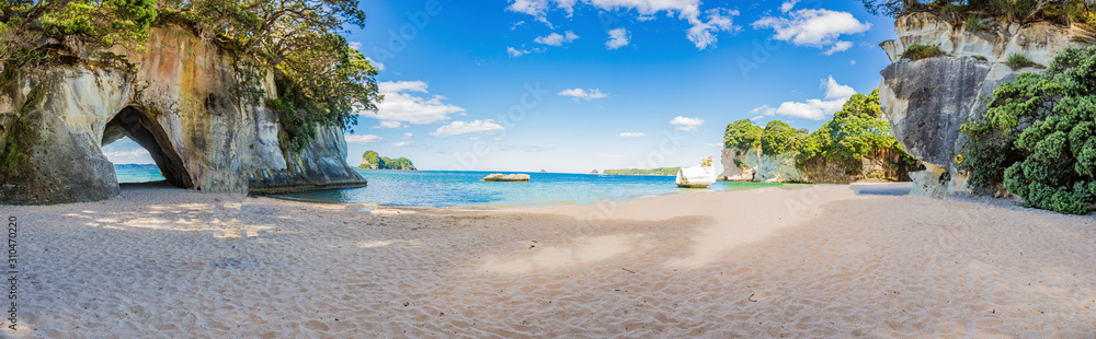 Panoramic picture of Cathedral Cove beach in summer without people during daytime - obrazy, fototapety, plakaty 