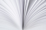 Fototapeta Na sufit - A light background from the white pages of a white open book