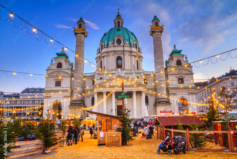 Obraz na płótnie Festive cityscape - view of the Christmas Market on Karlsplatz (Charles' Square) and the Karlskirche (St. Charles Church) in the city of Vienna, Austria w salonie