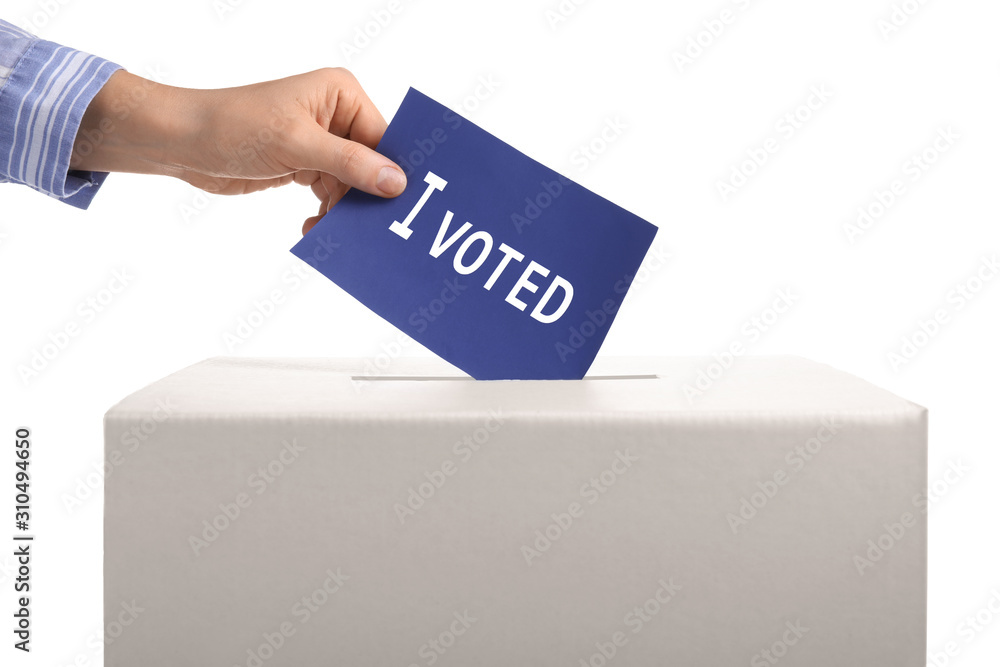 Woman putting ballot paper in voting box against white background