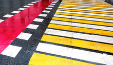 Pedestrian Crossing With White And Yellow Stripes
