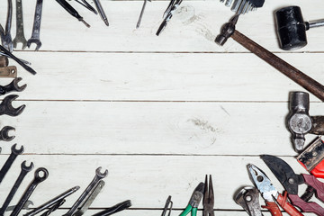 construction hammers screwdriver repair tool pliers on the board