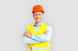 © Viktoriia - Construction. Mature man in hardhat and uniform standing isolated on white crossed arms smiling happy