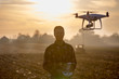 © Budimir Jevtic - Farmer driving drone above field