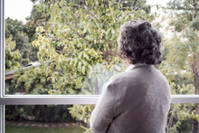 Back View, Portrait Of Elderly Asian Senior Woman With Grey Hair Looking Out Window For Thinking Seriously, Lifestyle Concept