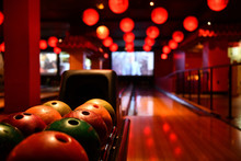 Bowling Lane And Balls In The Row In Bowling Center.
