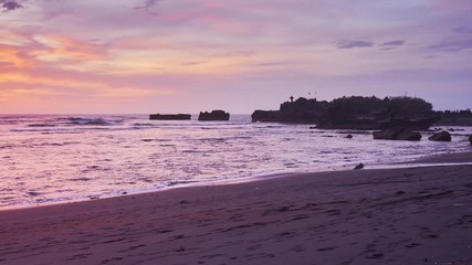 Wall Mural - Sunset view at the ocean coast line at Bali black sand beach long exposure  Timelapse