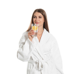 Canvas Print - Young woman drinking lemon water on white background