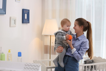 Poster - Teen nanny with cute little baby at home