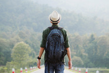 Young Traveler Wearing A Hat With Backpack Hiking Outdoor Travel Lifestyle And Adventure Concept.