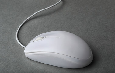 Modern wired computer mouse on grey background