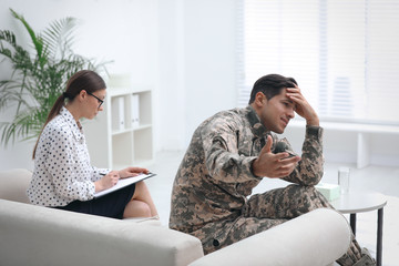 Poster - Psychotherapist working with male military officer in office