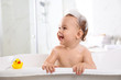 © New Africa - Cute little baby in bathtub at home