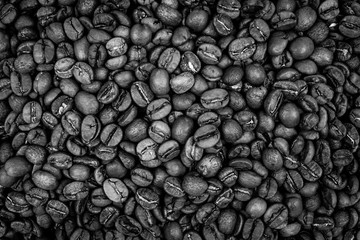 Wall Mural - High angle closeup shot of fresh black coffee beans