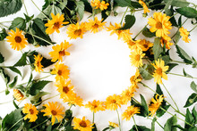 Round Frame Border Of Yellow Daisy Flowers On White Background. Mockup Blank Copy Space. Flat Lay, Top View Floral Composition.