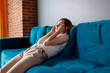 © Dmitrii Kotin - Young woman feels bad and suffering from headache at home.