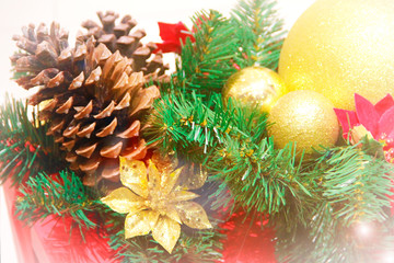 festive multi-colored toys balls, cones, tree branches and decor