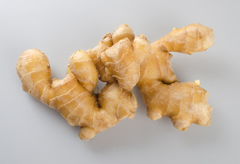 Wall Mural - ginger or ginger root on the background new.