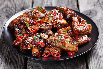 Canvas Print - crispy teriyaki chicken wings on a plate