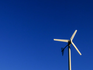 Windmill over the blue sky, energy from sustain resource.