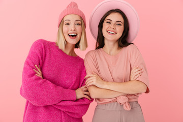 Sticker - Image of two excited women smiling and standing with arms crossed