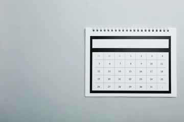 Sticker - Paper calendar on light grey background, top view. Space for text